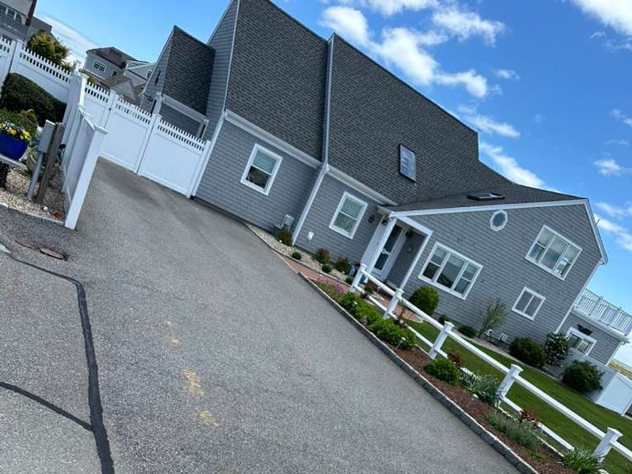 Driveway before crack sealing with visible long cracks